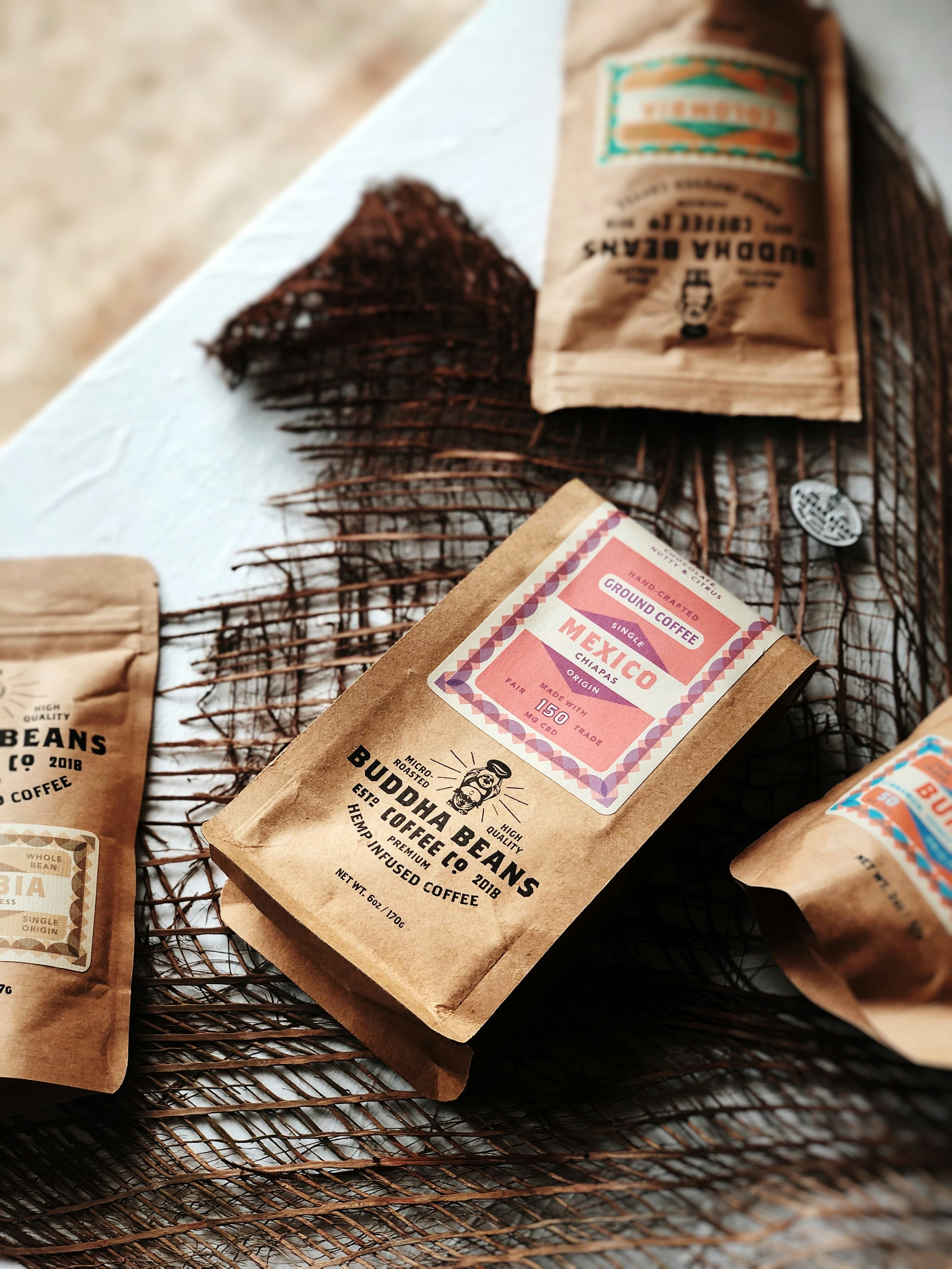 Kraft-paper coffee bags with retro labels on burlap