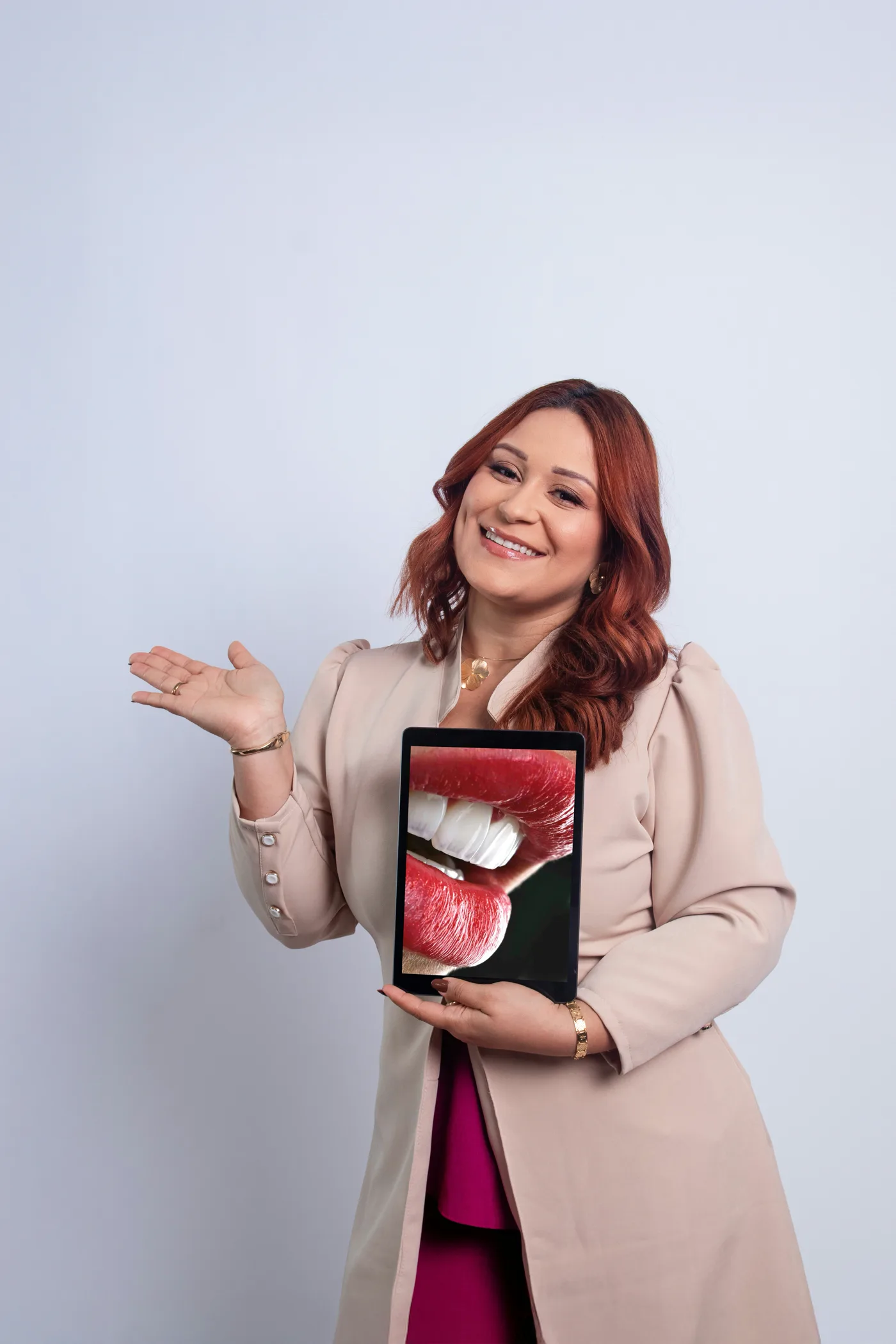 Practice owner presenting her clinic's new website on a tablet