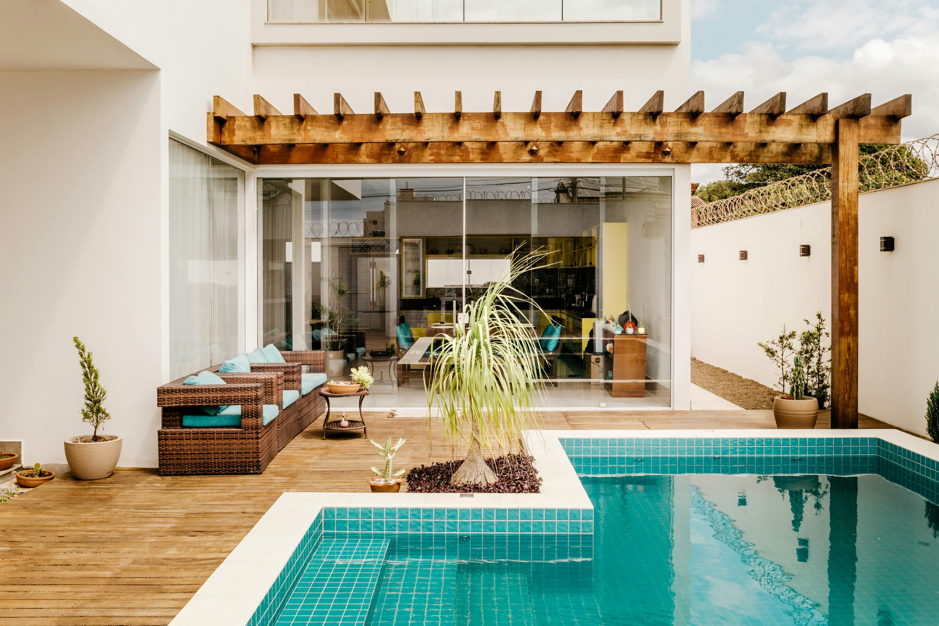 Turquoise pool under a timber pergola