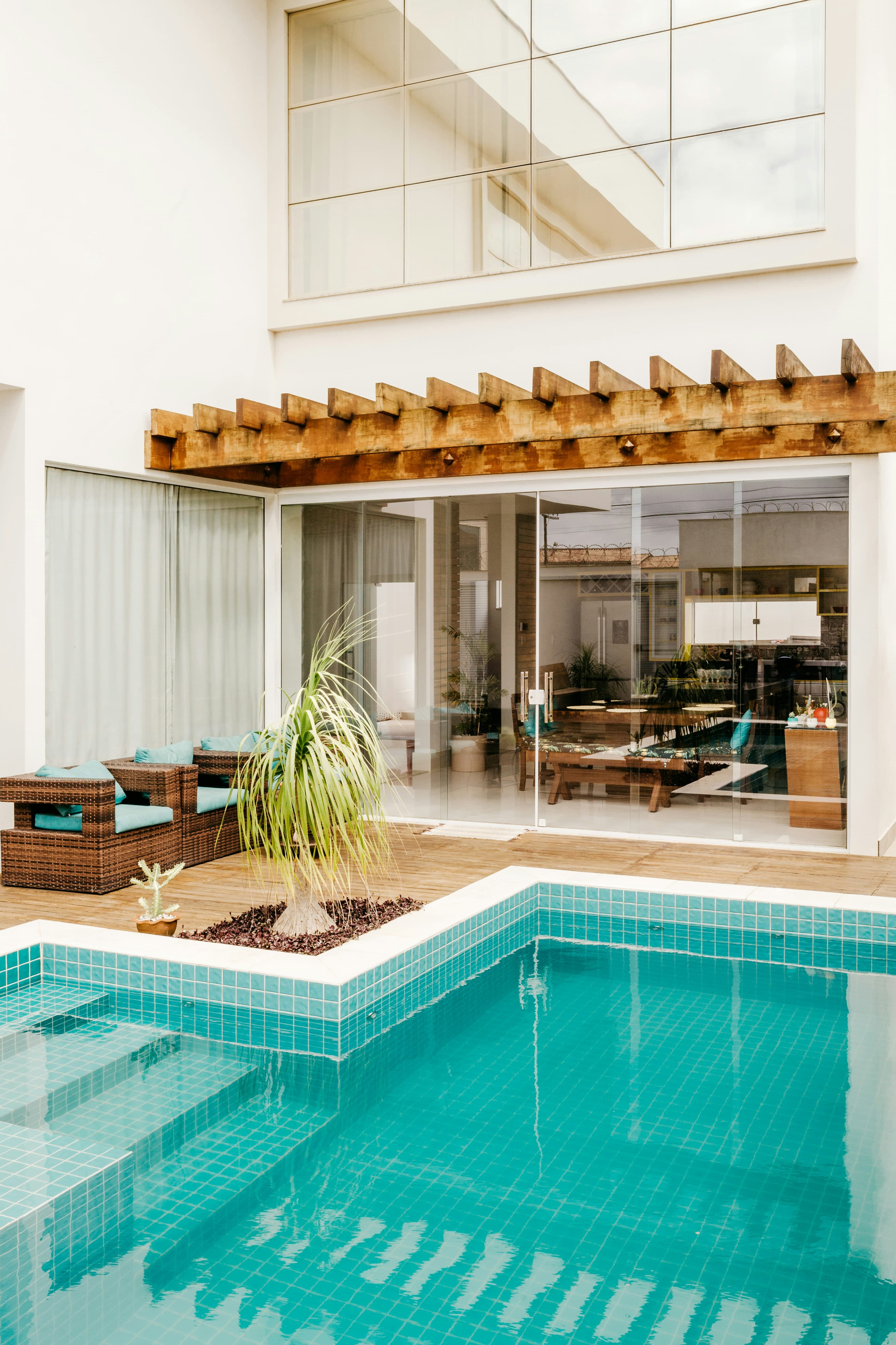 Two-storey home over a turquoise tiled pool